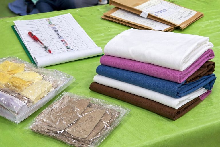 Fabric swatches and sample materials prepared for custom plush toy development